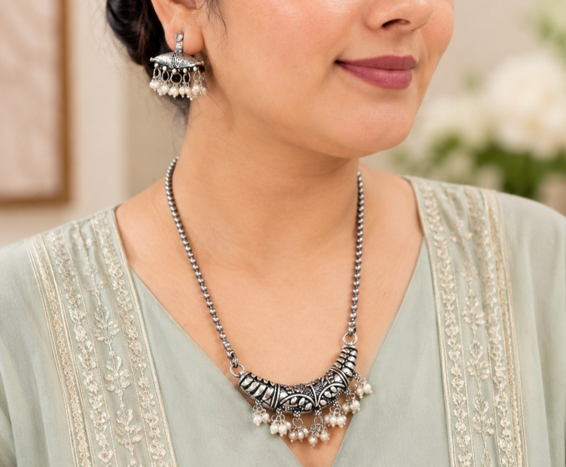 Chandrika Oxidised Necklace Set : Elegant and timeless, the Banjaaransoul Chandrika Pearl Necklace Set blends traditional oxidised artistry with delicate pearl accents, creating a graceful statement f - back view