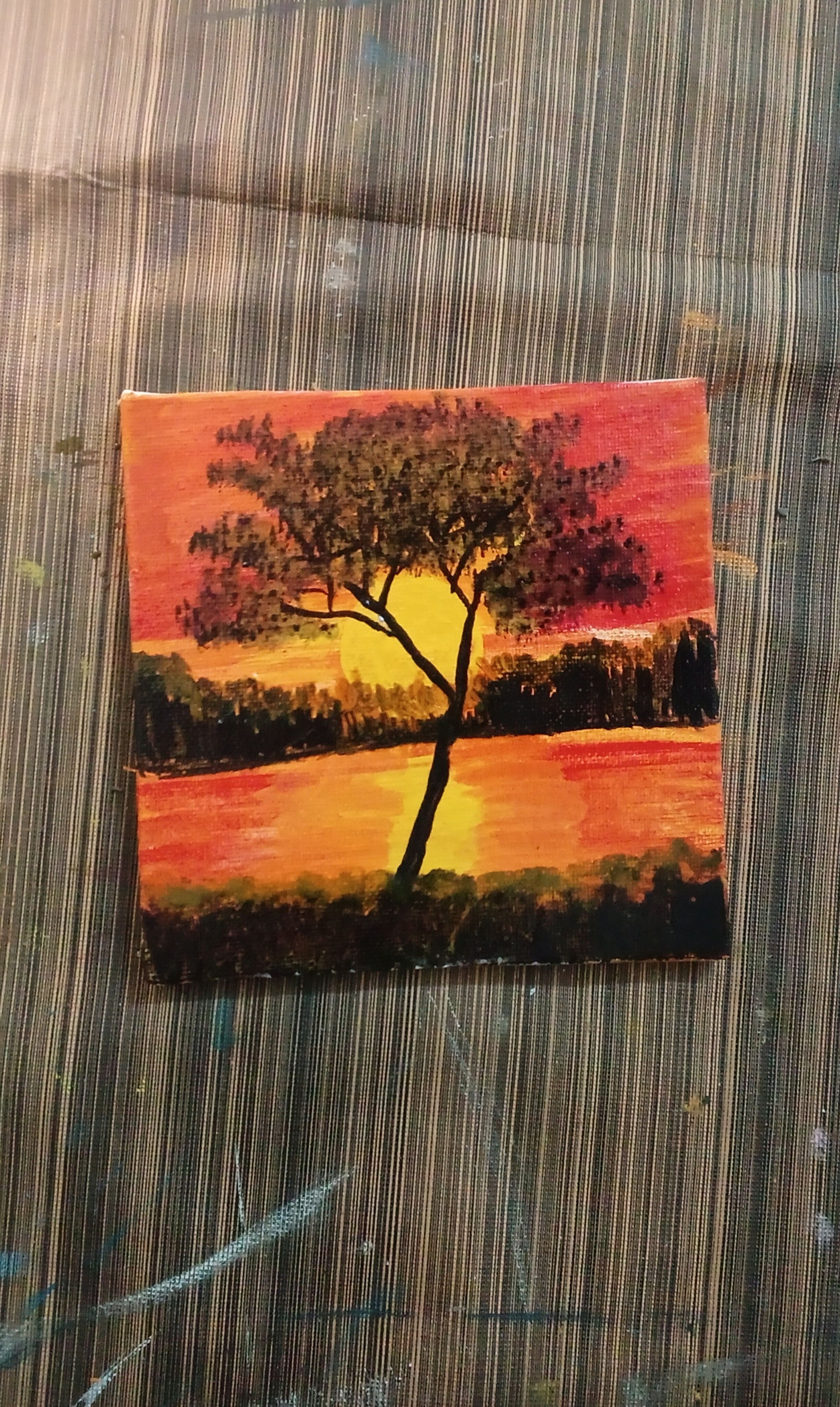 Silhouette tree in sunset waves
